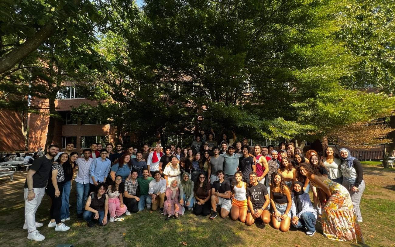 Group picture of SAS standing in front of a building on grass