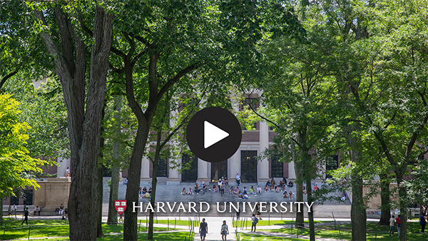 image of university hall with a play button on it. 