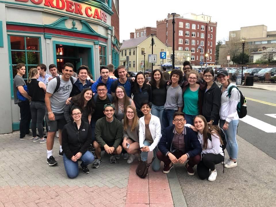 A group of students posing for a picture outside of Border Cafe