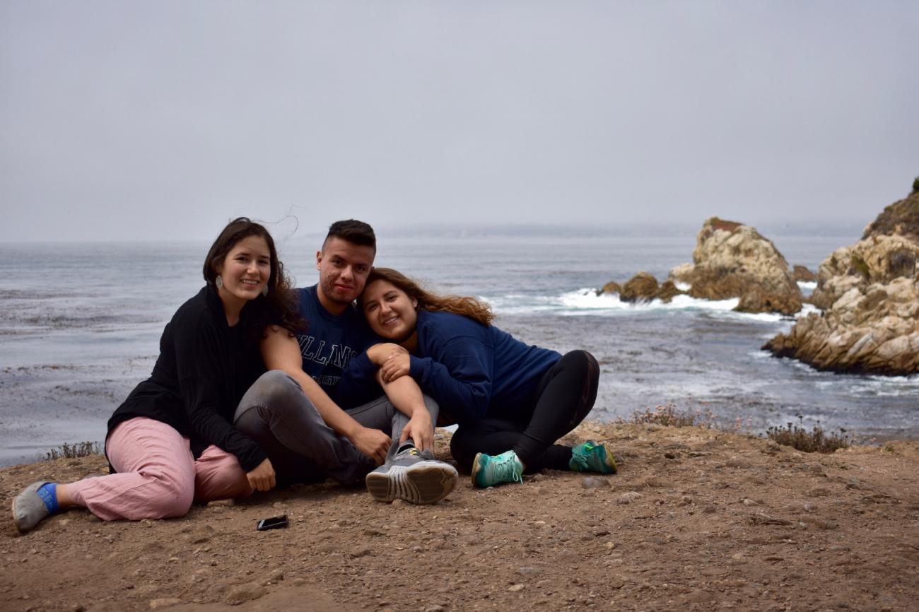 three people on a beach