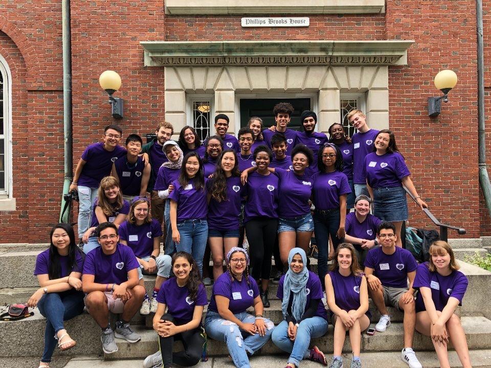 group of students wearing purple