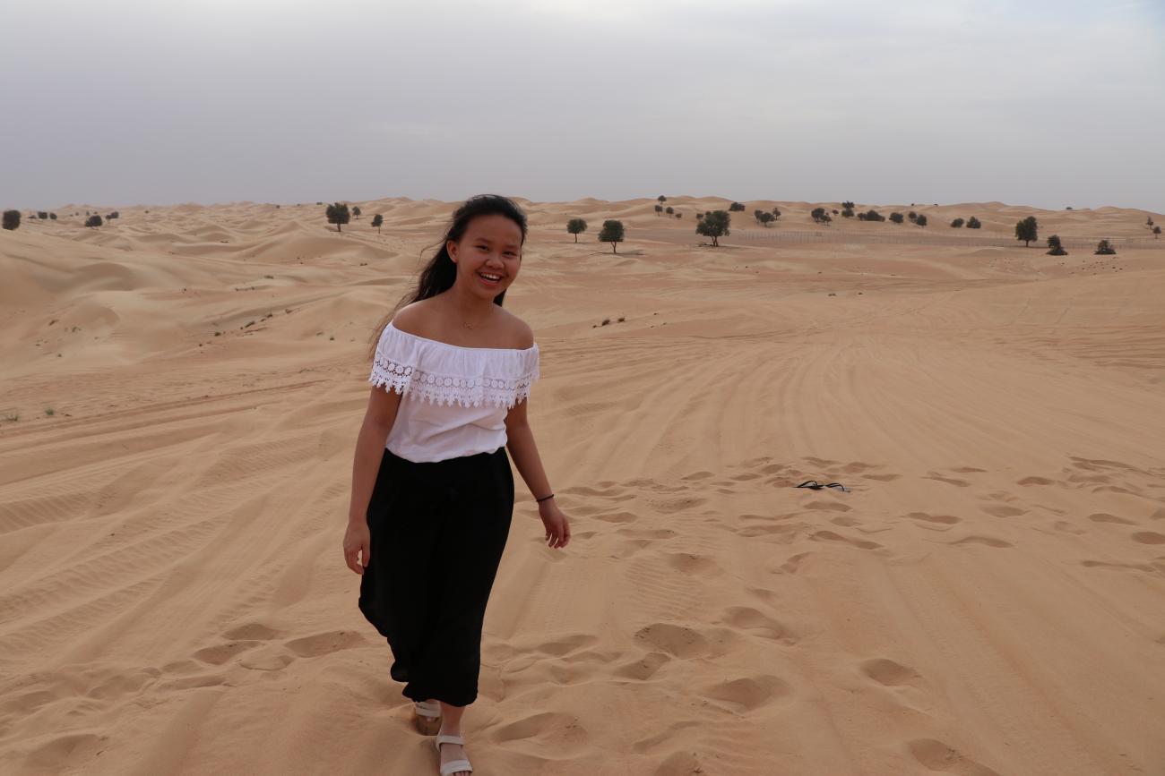 Student walking in dessert