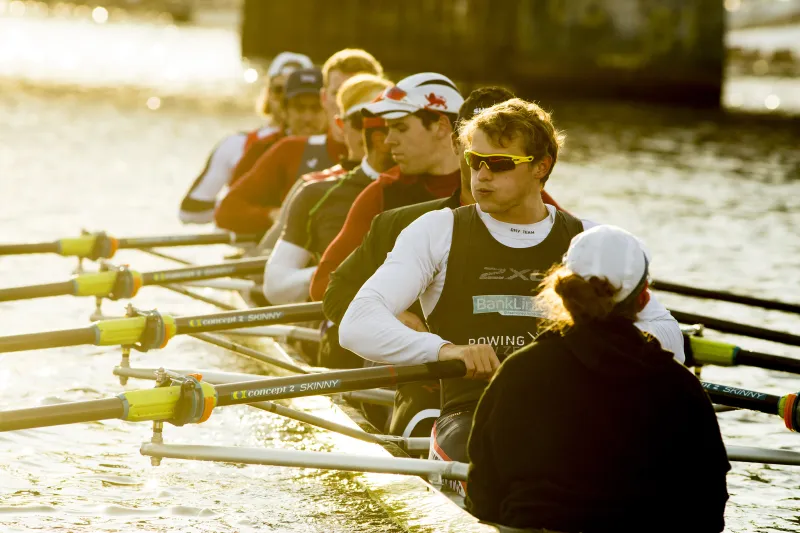 students row  down the Charles river