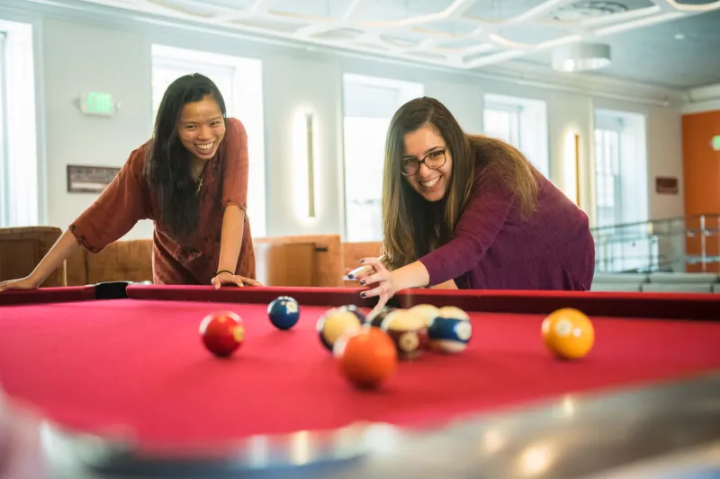 Students playing pool