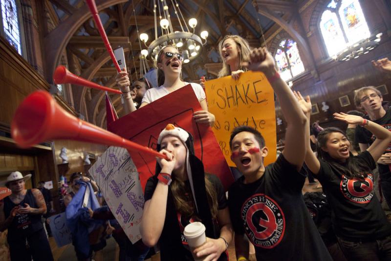 Students celebrating Harvard festivities in dining hall
