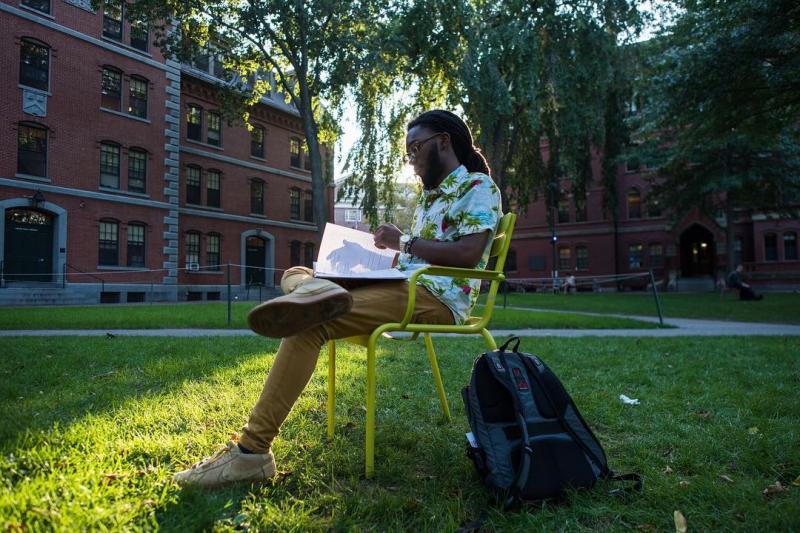 Student studying in Harvard Yard