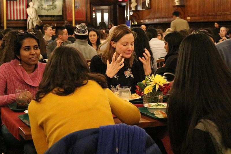 Professor and students eating dinner