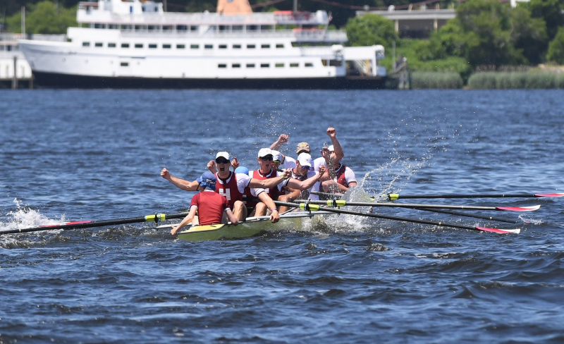 students rowing in Charles River