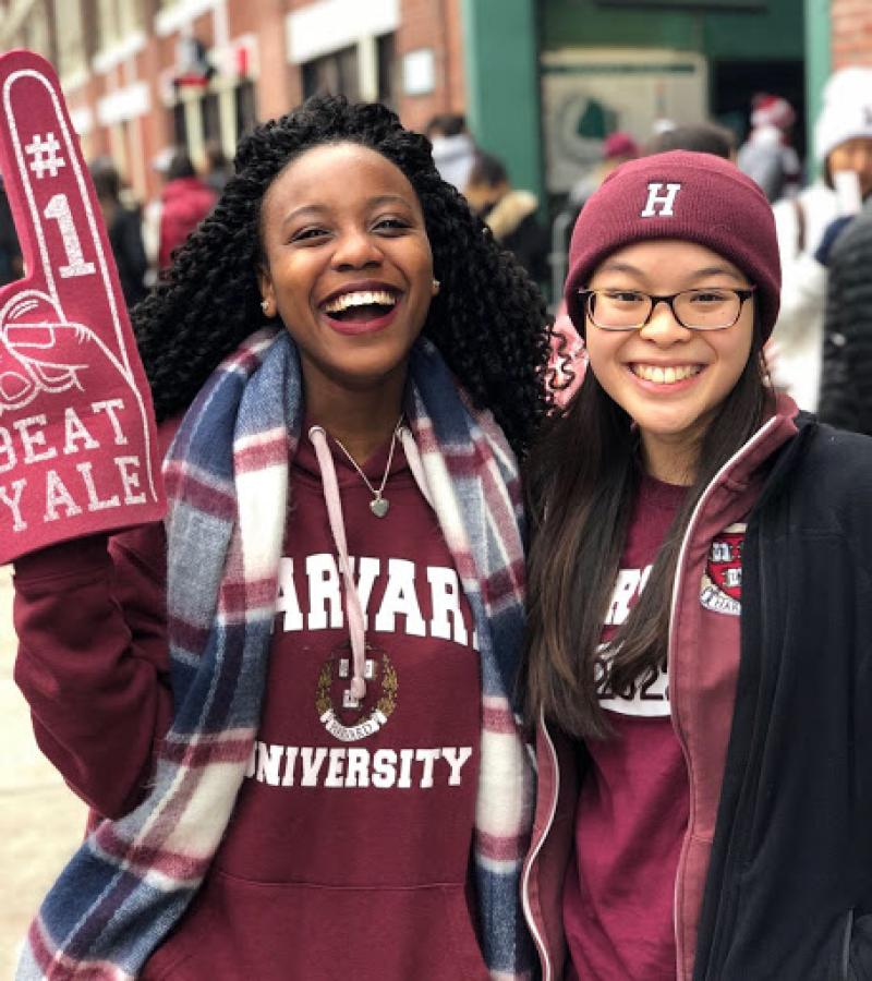 a picture of me and my roommate during the Harvard Yale game