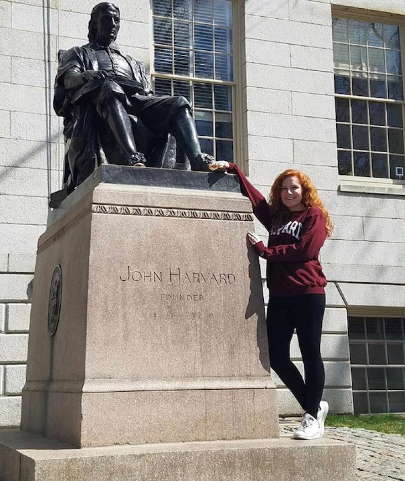 ally touching the john harvard statue