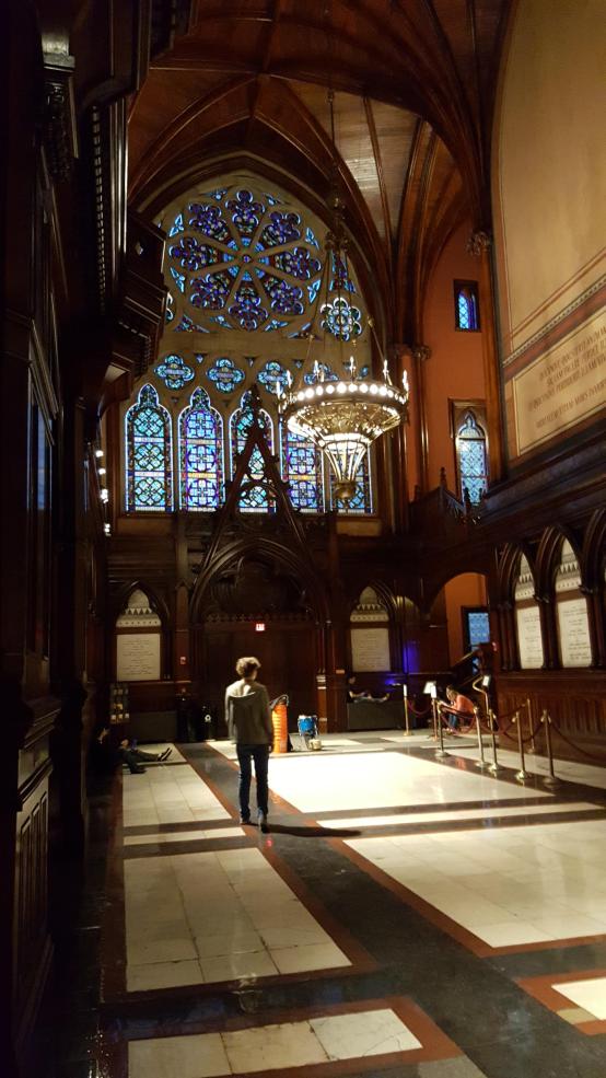 A picture of some of the window art in Sanders Theatre, a performance space at Harvard. 