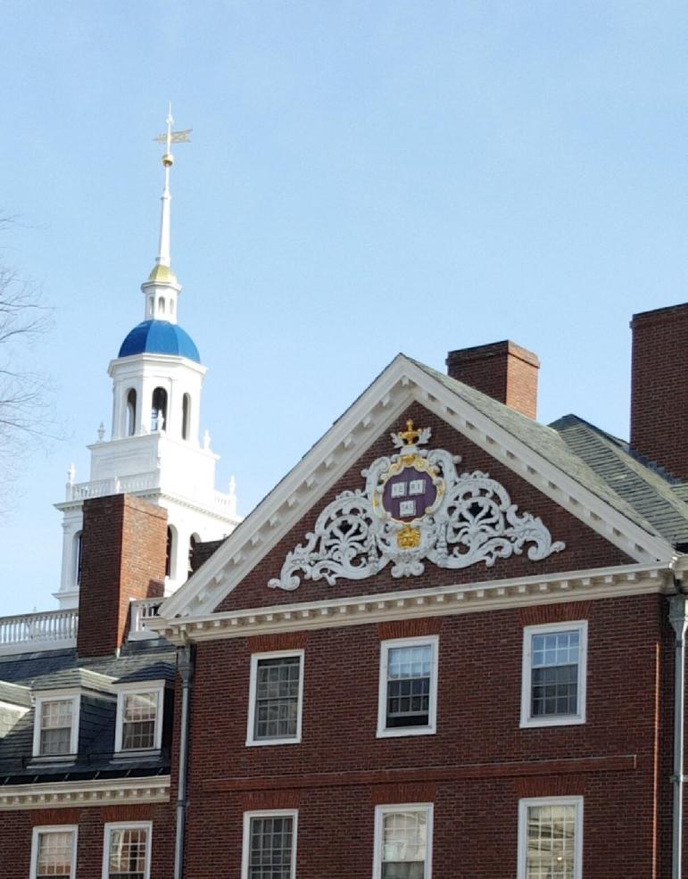 A picture of a Harvard building with a clear, blue sky as the background. 