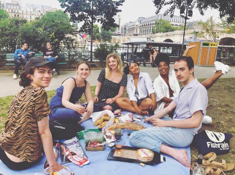 Malia and friends having a picnic by the Seine River
