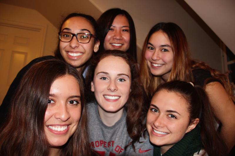 Six female students smiling at camera