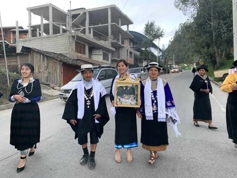 Amy's family participating in a ceremonial procession