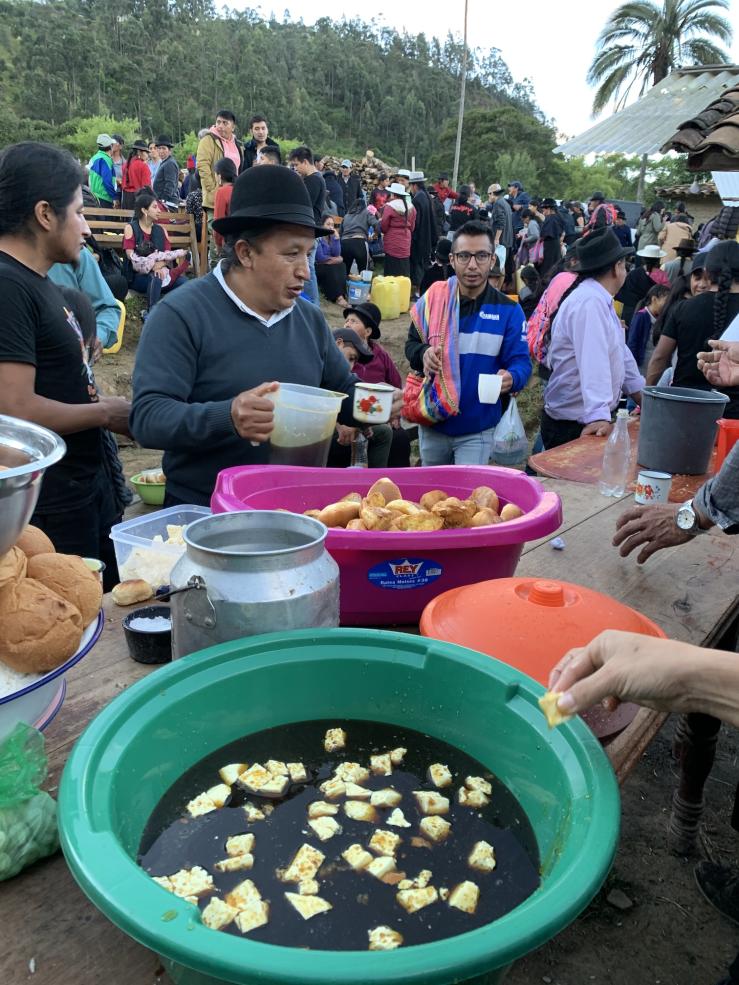 Serving food at the community gathering