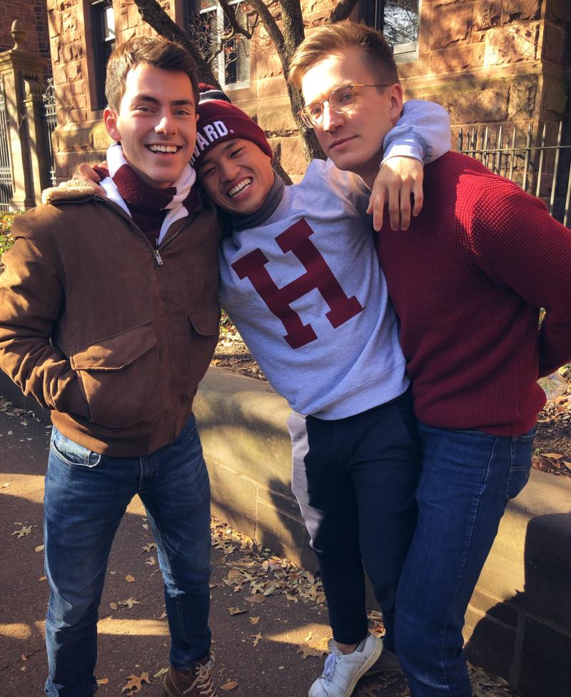 Author with his roommates standing outside in the fall weather