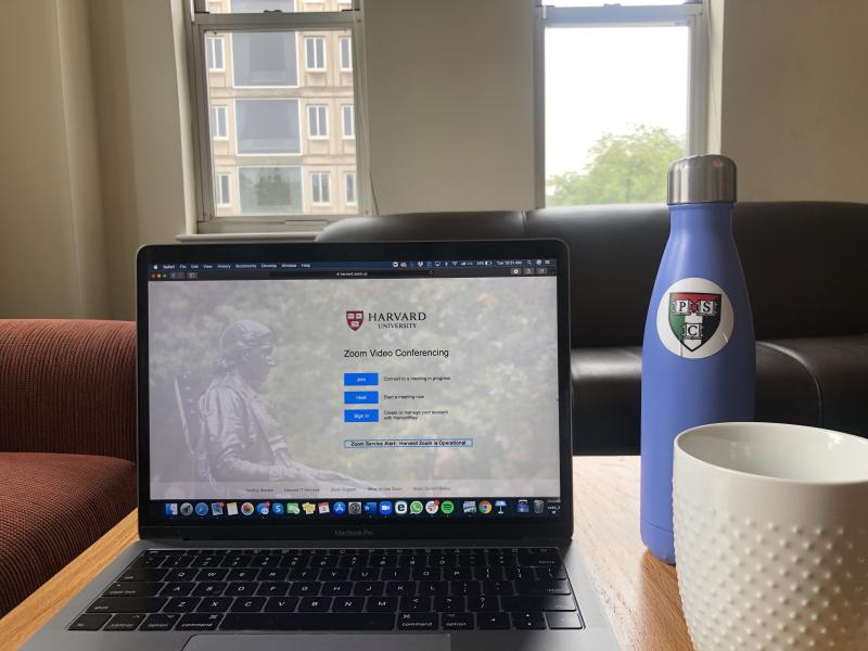 My laptop, water bottle, and coffee setup for work