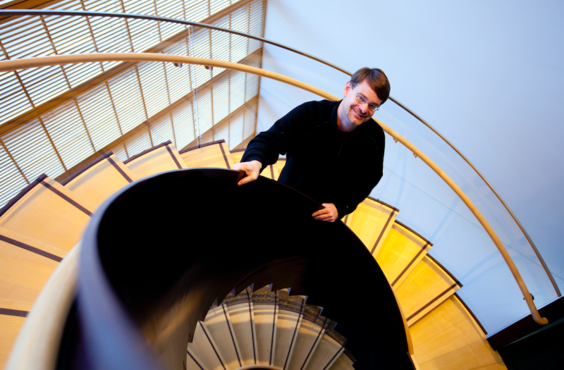 Walter Johnson stands on a staircase.