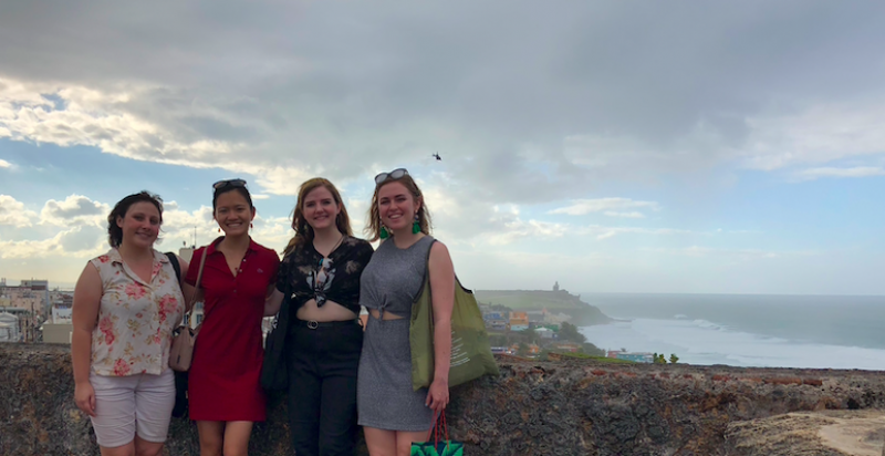 Four women standing at the Castillo San Felipe del Morro, a historical site in San Juan