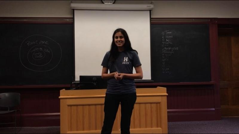 Student standing up to speak in front of a class