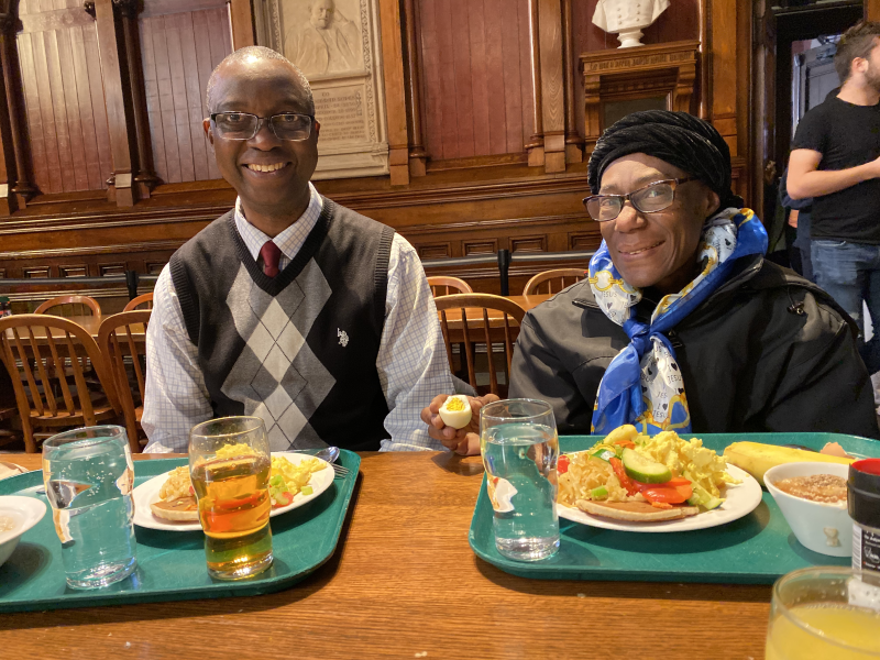 parents smiling with their trays in Annenberg