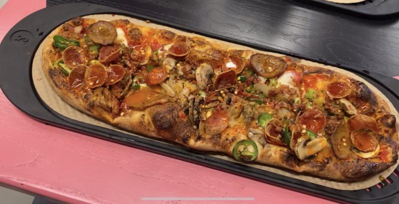 rectangular pizza with many toppings