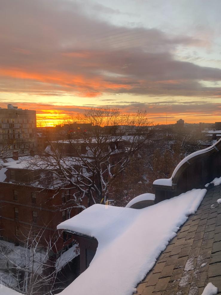 A sunset over the Smith Center from the top floor Weld Solarium