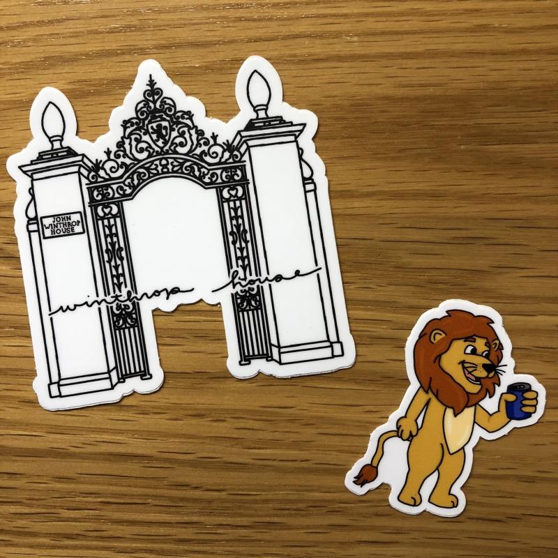 Photo of two stickers - a gate and a lion