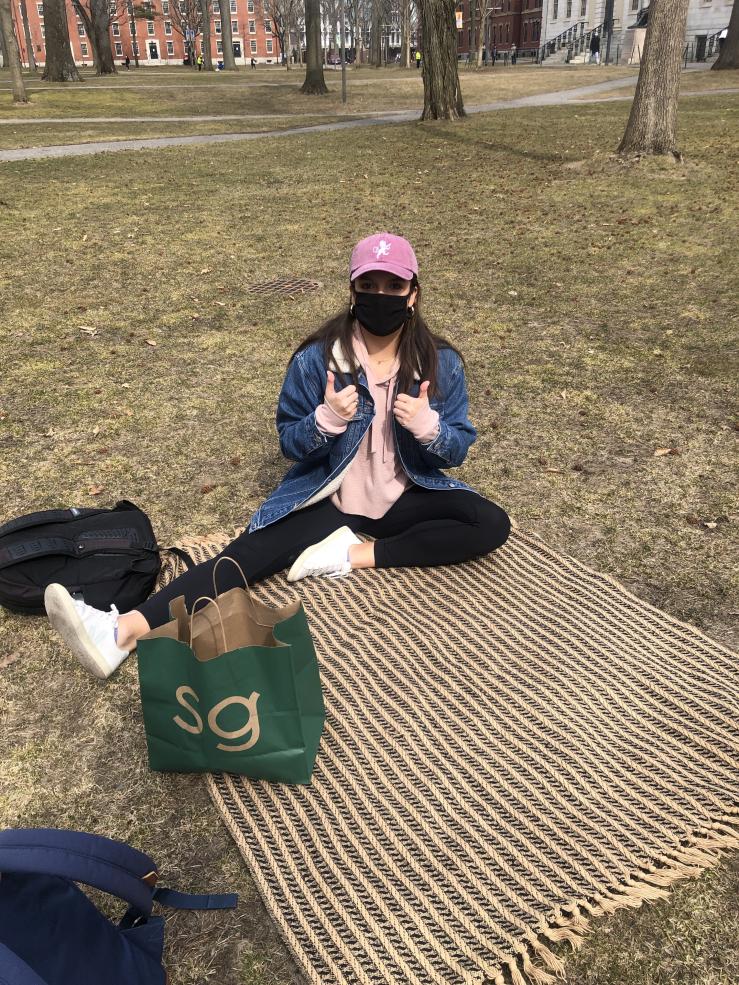 My friend sitting in Harvard Yard