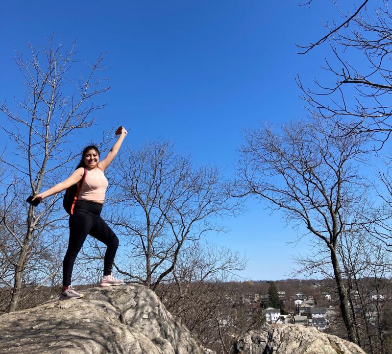 Girl standing on a cliff.