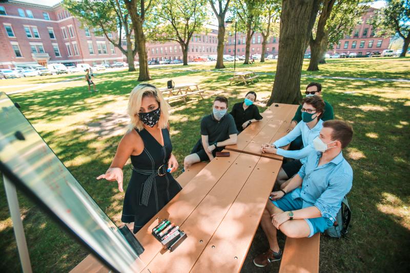 Professor Prineha Narang teaches a small group of students.