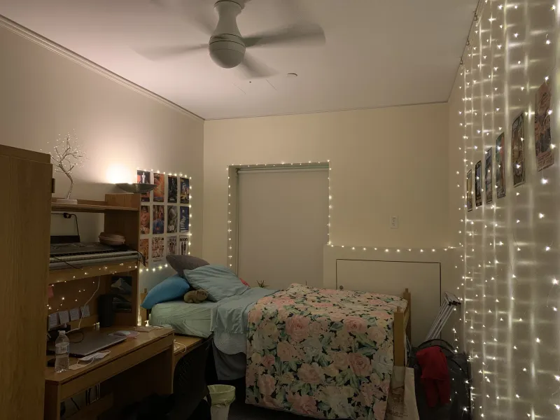 A dorm room in Claverly Hall with decorations including lights and posters