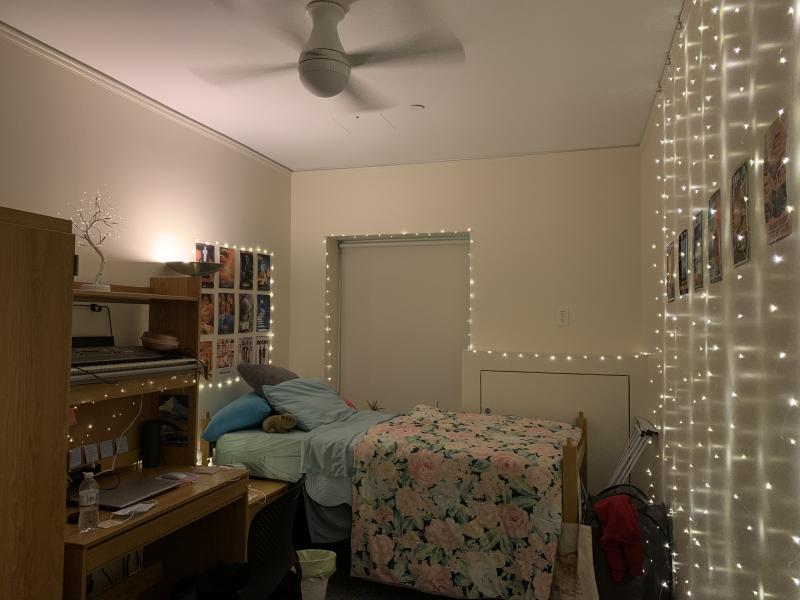 A dorm room in Claverly Hall with decorations including lights and posters