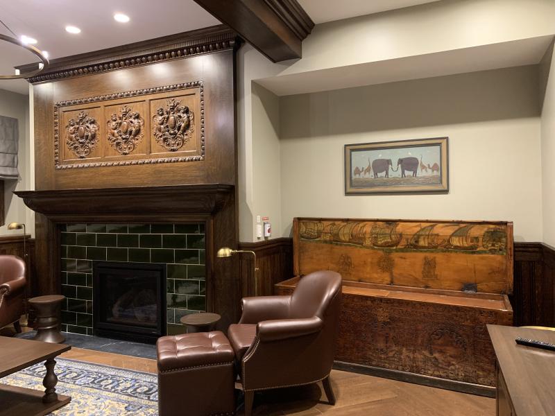 Claverly Hall Menin Common Room with furniture and a fireplace