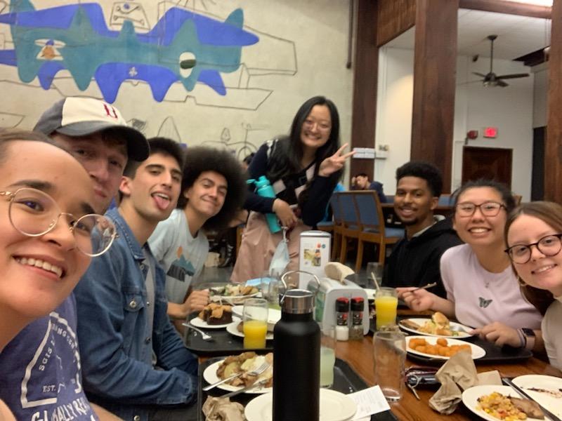 A picture of me and some friends eating inside Quincy dining hall