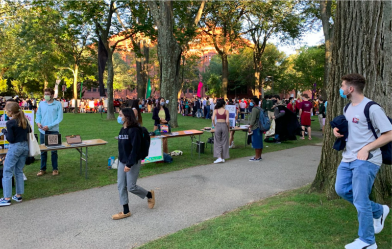 A picture of students walking around and visiting tables at the Student Involvement Fair.