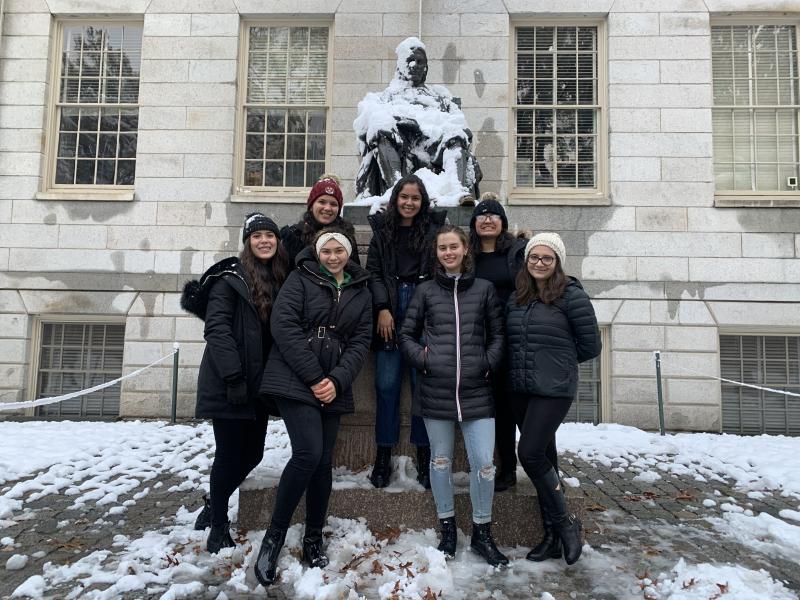My friends and I in front of the John Harvard Statue after playing in the snow