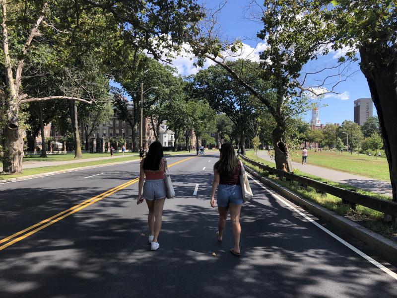 Two people walking down Memorial Drive