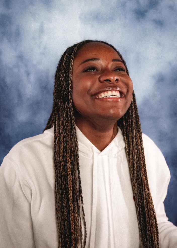 Portrait of female student smiling looking up and to the right