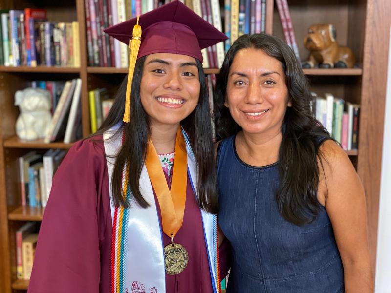 a picture of my mom and I. I am wearing my graduation gown