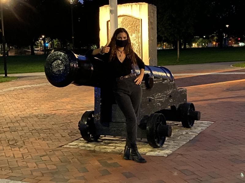 Image of me next to a cannon in Cambridge Commons at night