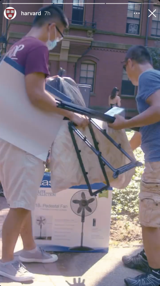 A picture of Raymond and his dad carrying luggage.