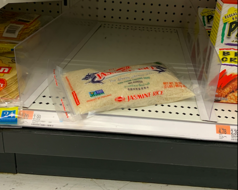 A bag of jasmine rice on a shelf.