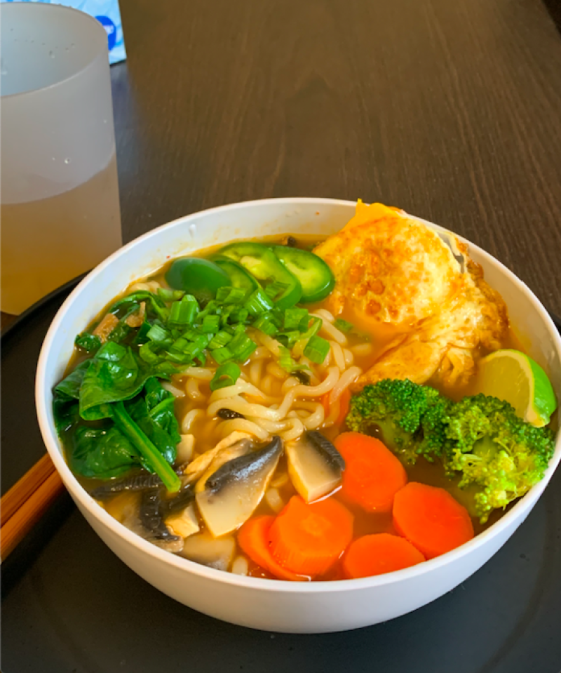 A bowl of ramen with a variety of toppings.