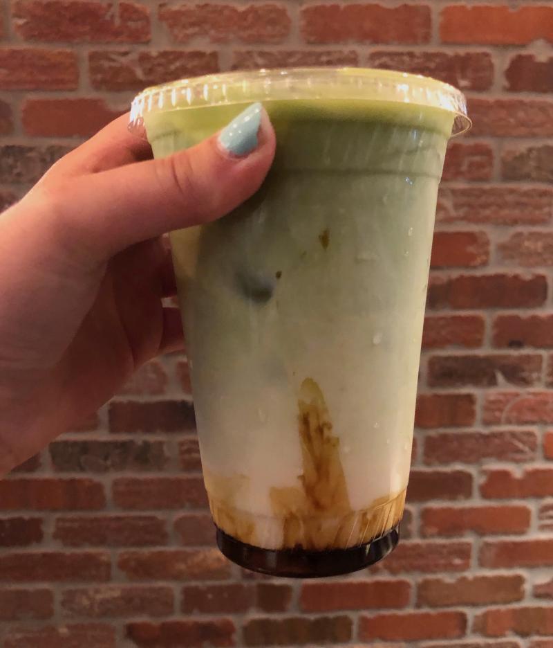 Photo of an iced matcha latte with brown sugar
