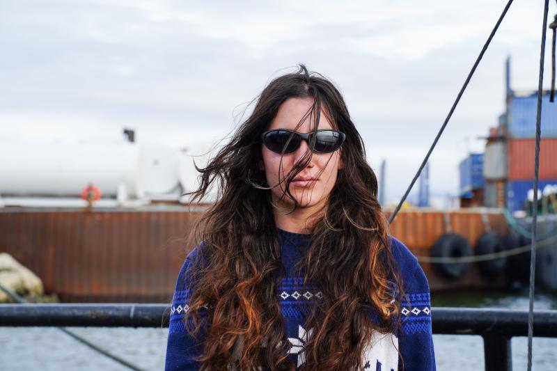 Writer wearing sunglasses on the dock