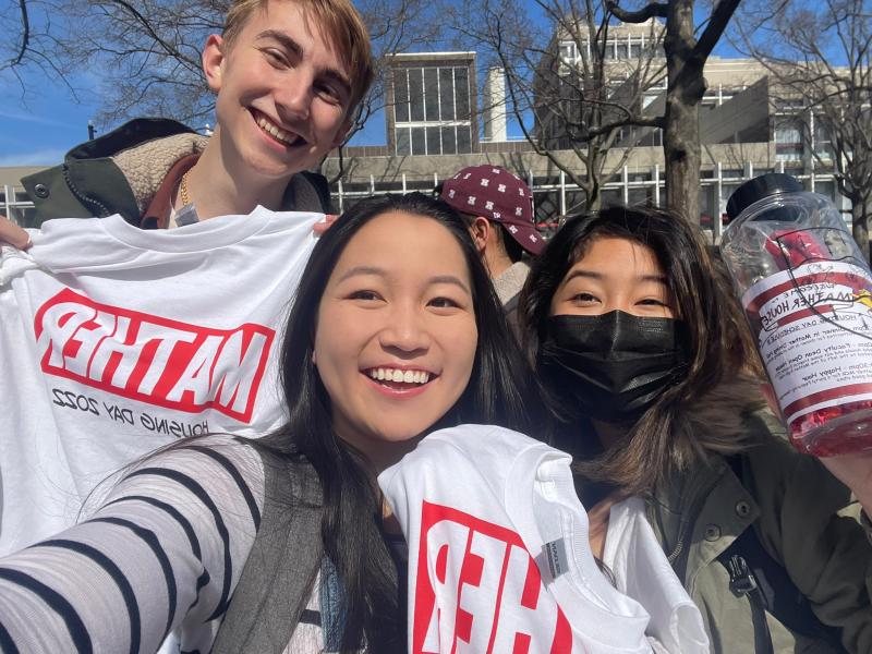 Izumi and two friends taking a selfie with their Mather House t-shirts