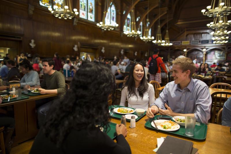 Students eating and talking at Annenberg