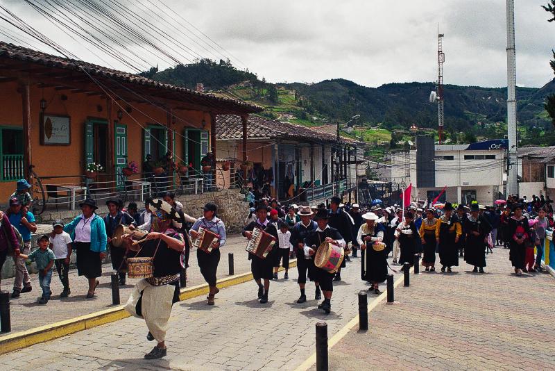 Saraguros playing instruments on the streets for annual Easter procession